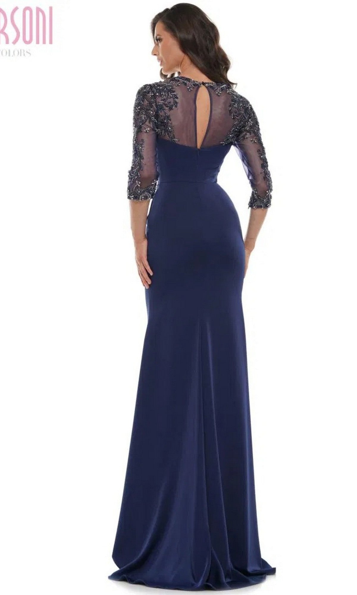 A woman models the floor-length Marsoni MV1070 long formal dress in navy blue, featuring lace sleeves and a keyhole back, against a plain white background.